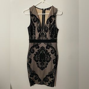 Beige and black lace body con mini dress. Size Medium